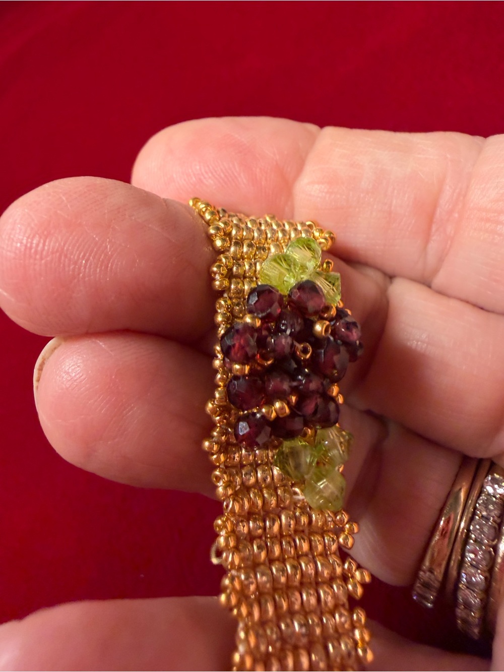 Hand woven gold color seed bead bracelet with garnet and crystal floral accent - Picture 6 of 8